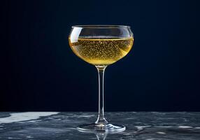 Golden Sparkling Wine on Dark Marble photo