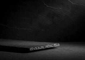 Dark Slate Platform Against Textured Background photo