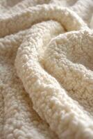 Soft and cozy boucle fabric draping gently in natural light photo