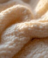 Close-up view of soft boucle fabric showcasing its texture and warmth photo