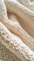 Soft beige boucle fabric showcasing textured warmth and comfort photo
