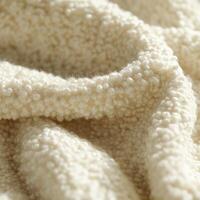 Soft boucle fabric showcasing intricate texture and cream color photo