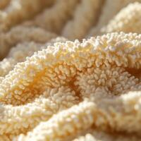 Soft boucle fabric showcases intricate texture in warm tones photo