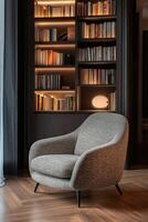 Cozy armchair beside a bookshelf in a modern living space photo