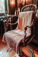 Microfiber towel on a vintage salon chair in a barbershop photo