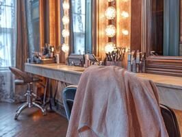 Microfiber towel hanging on a salon chair in a stylish beauty studio photo