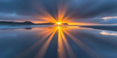 Golden sunlight breaks through clouds at the beach photo