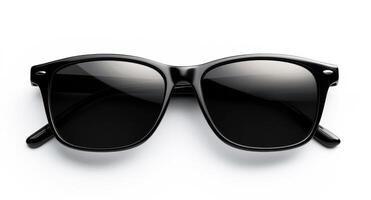 Classic black sunglasses on a white surface for summer style photo
