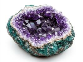 Beautiful amethyst geode with vibrant purple crystals and green matrix photo