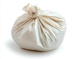 Trash bag tied tightly for secure disposal in a clean environment photo