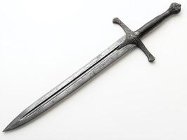 Detailed medieval sword resting on a surface with intricate design photo