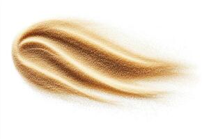 Golden powder flowing softly over a smooth surface photo