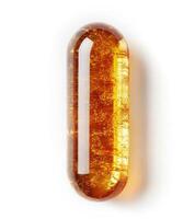 Golden amber capsule with intricate textures and details photo