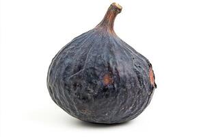 Fresh black fig resting on a clean surface in natural light photo