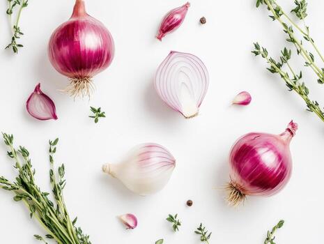 Fresh onions and thyme arranged on a clean white surface photo