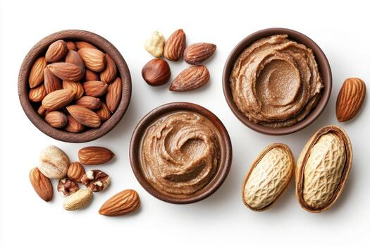 Various nut butters and whole nuts displayed in wooden bowls photo