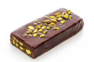 Dark chocolate bar with pistachios on white background photo