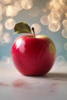 Fresh red apple with green leaf on a blurred bokeh background, highlighting its glossy surface and natural color photo