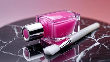 Bright pink nail polish bottle on marble surface with applicator brush in soft lighting set up for a beauty display photo