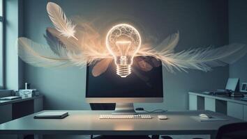 Bright idea emerging from a computer in a modern office setting with wisps of feathers in the air photo