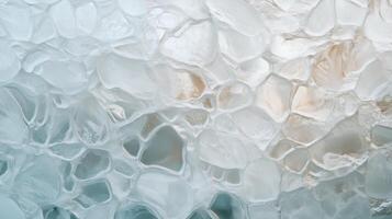 Close-up of textured ice with bubbles creating a unique abstract pattern in natural lighting photo