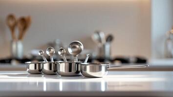 Sleek stainless steel measuring cups and spoons set in a modern kitchen on a sunny afternoon photo