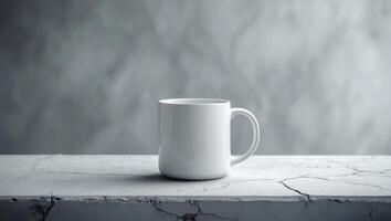 Empty white mug placed on a cracked marble tabletop in a minimalistic setting with soft lighting photo