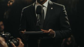 Speaker presents important speech while surrounded by cameras and an attentive audience at a formal event photo