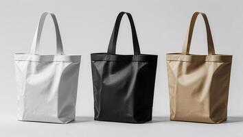 Stylish reusable tote bags showcasing minimalist design in three classic colors arranged on a simple backdrop photo