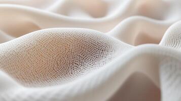 Textured fabric drapes softly in neutral tones creating a serene atmosphere on a warm afternoon photo