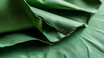 Beautiful green textured paper folded elegantly with soft creases and subtle light reflections during daylight photo