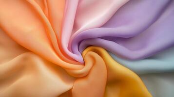 Colorful silk fabric in pastel shades arranged in a circular pattern showcasing smooth textures and vibrant tones photo