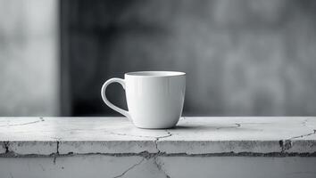 Simple white cup on a textured marble countertop in a softly lit room photo