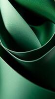 Elegant folds of green fabric create a mesmerizing abstract pattern in soft light photo