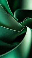 Rich green fabric drapes gracefully, showcasing smooth texture and delicate folds in abstract display of color and form photo