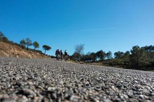 Cyclists climbing a mountain pass. photo