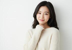 Smiling Asian Woman in Cream Sweater Portrait photo