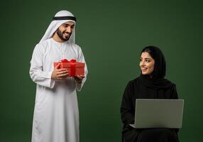 Man Giving Gift to working woman Green Background photo
