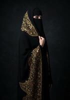 Portrait of a Saudi Arabian Gulf woman wearing a burqa and abaya photo
