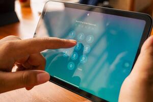March 08, 2025, Semarang, Indonesia, Apple iPad product displays security code screen photo