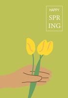 Hand holding yellow tulips on green background with happy spring text design vector