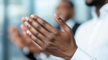 Hands of diverse individuals clapping in professional setting, expressing joy and appreciation during business event. atmosphere is positive and engaging photo
