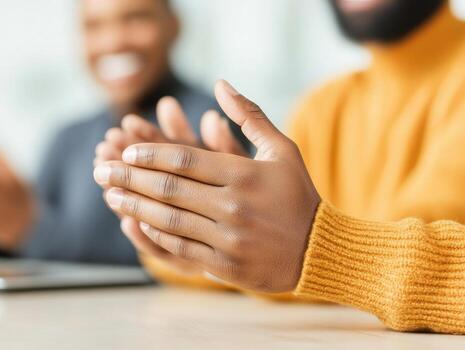 team of professionals clapping in creative workspace, showcasing collaboration and enthusiasm. warm atmosphere highlights teamwork and positive engagement photo