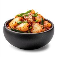 bowl of spicy Korean kimchi with radish, chili paste, and green onions, garnished with sesame seeds, showcasing vibrant colors and textures photo