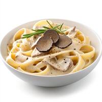 Creamy truffle pasta dish with fettuccine, topped with sliced truffles and herbs, showcasing gourmet flavors and rich texture. Perfect for food lovers photo