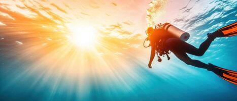 Scuba diver exploring underwater with sunlight rays illuminating ocean, creating vibrant and serene atmosphere. diver fins and equipment enhance adventure photo