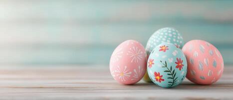 Hand painted Easter eggs with floral designs on wooden surface, showcasing pastel colors and intricate patterns. Perfect for spring celebrations and festive decor photo