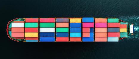 Vibrant cargo ship loaded with colorful containers sailing on water, showcasing variety of hues and patterns. scene captures essence of maritime transport and trade photo