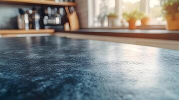 Empty dark countertop in modern kitchen with blurred background. photo