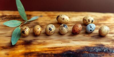 Quail eggs arranged with willow branches on a rustic wooden surface photo